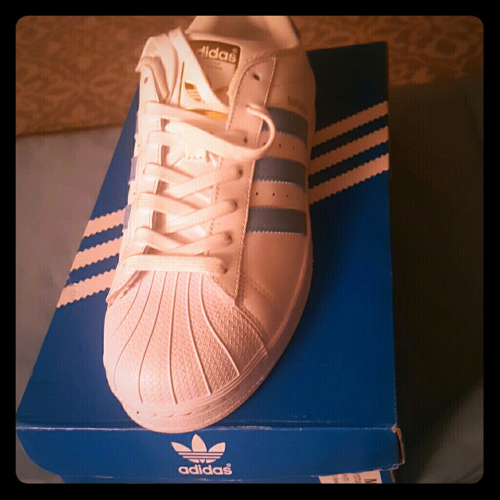 Sky blue and white Adidas shell toe